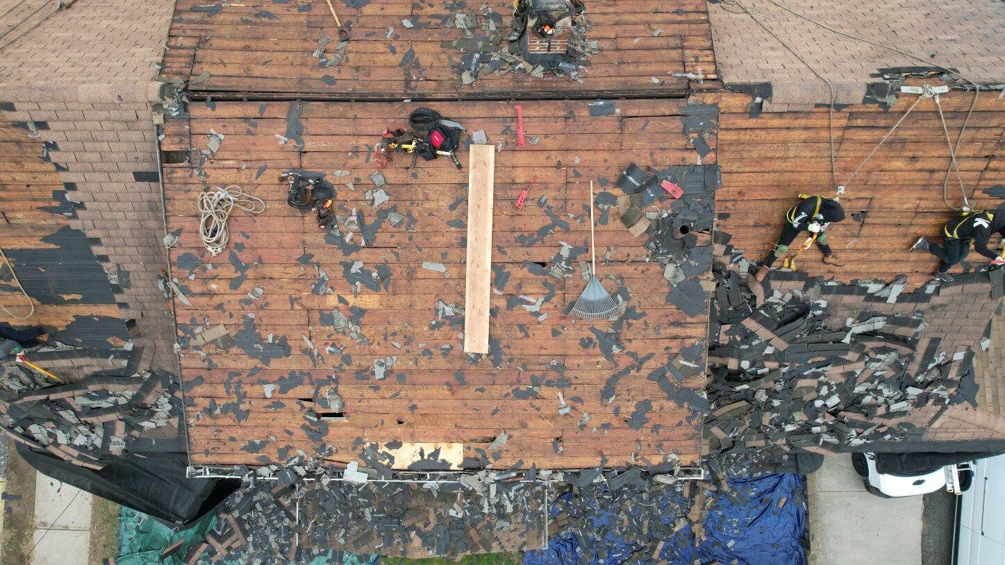 Exposed wood roof deck during an asphalt shingle tear-off. Roofing work by Alba Pro Construction serving Glen Rock, NJ.