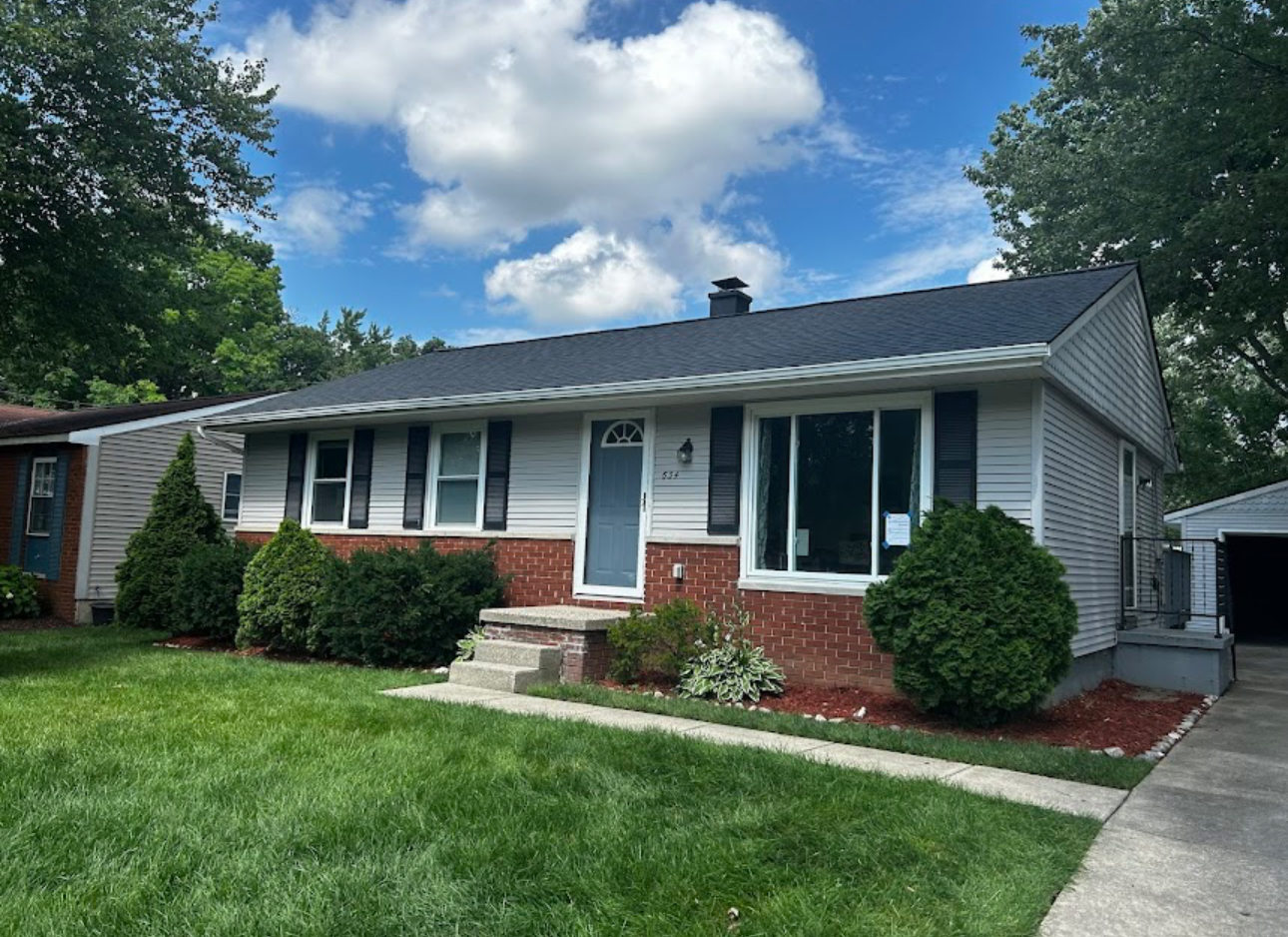 Ranch home with a completed dark grey architectural shingle roof and clean new drip edge. Roofing work by Alba Pro Construction serving Paterson, NJ.