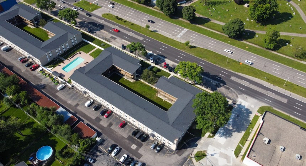 Aerial view of a multi building apartment property with completed grey architectural shingle roofs. Roofing work by Alba Pro Construction serving Hackensack, NJ.